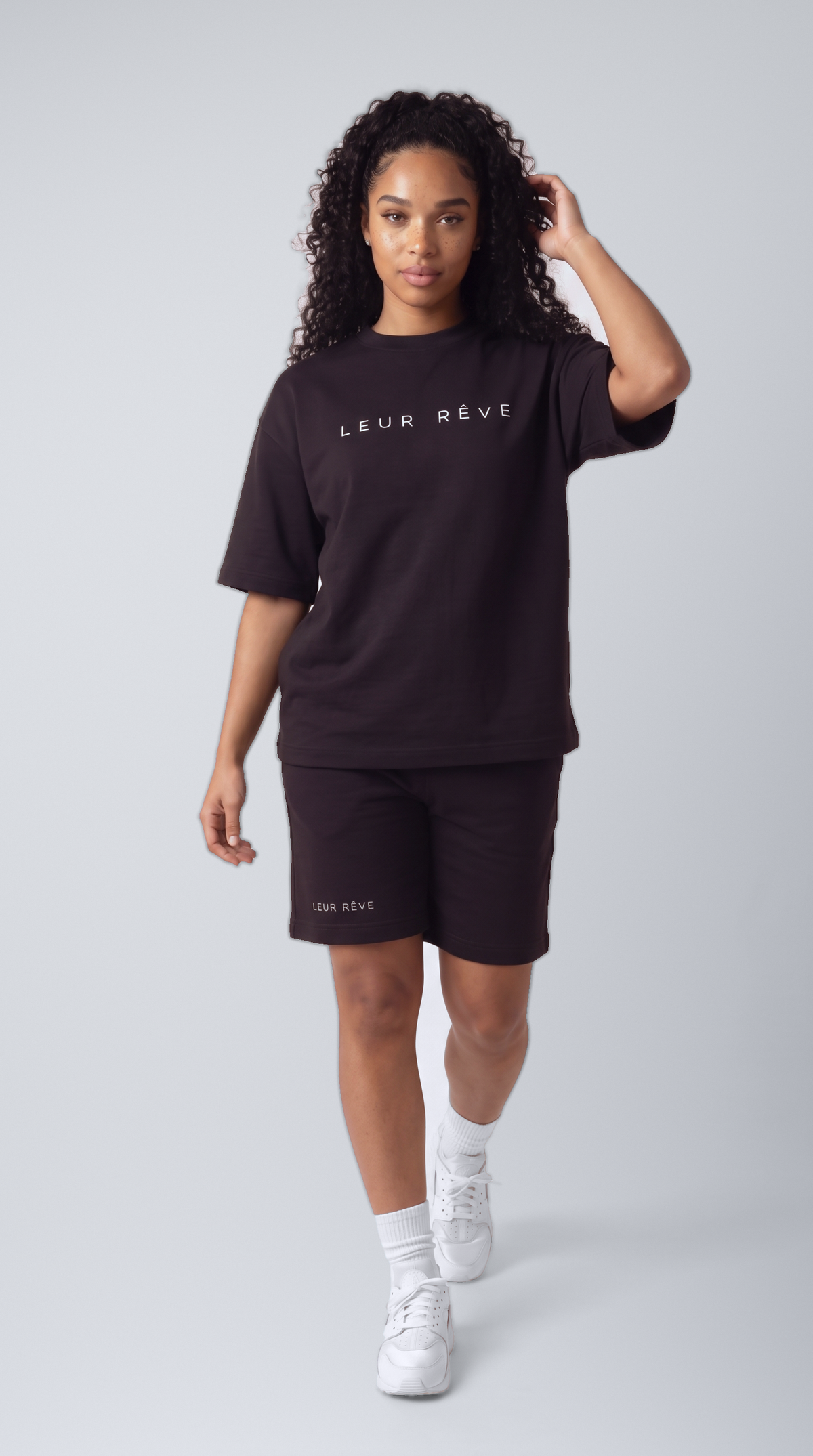 Woman wearing the Leur Rêve Short in black, mid-stride