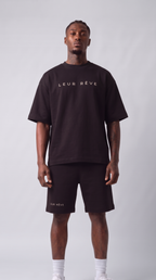 Man wearing the Leur Rêve Set in black, standing, front view