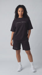Blue in the Leur Rêve black tee and short, moving in the studio